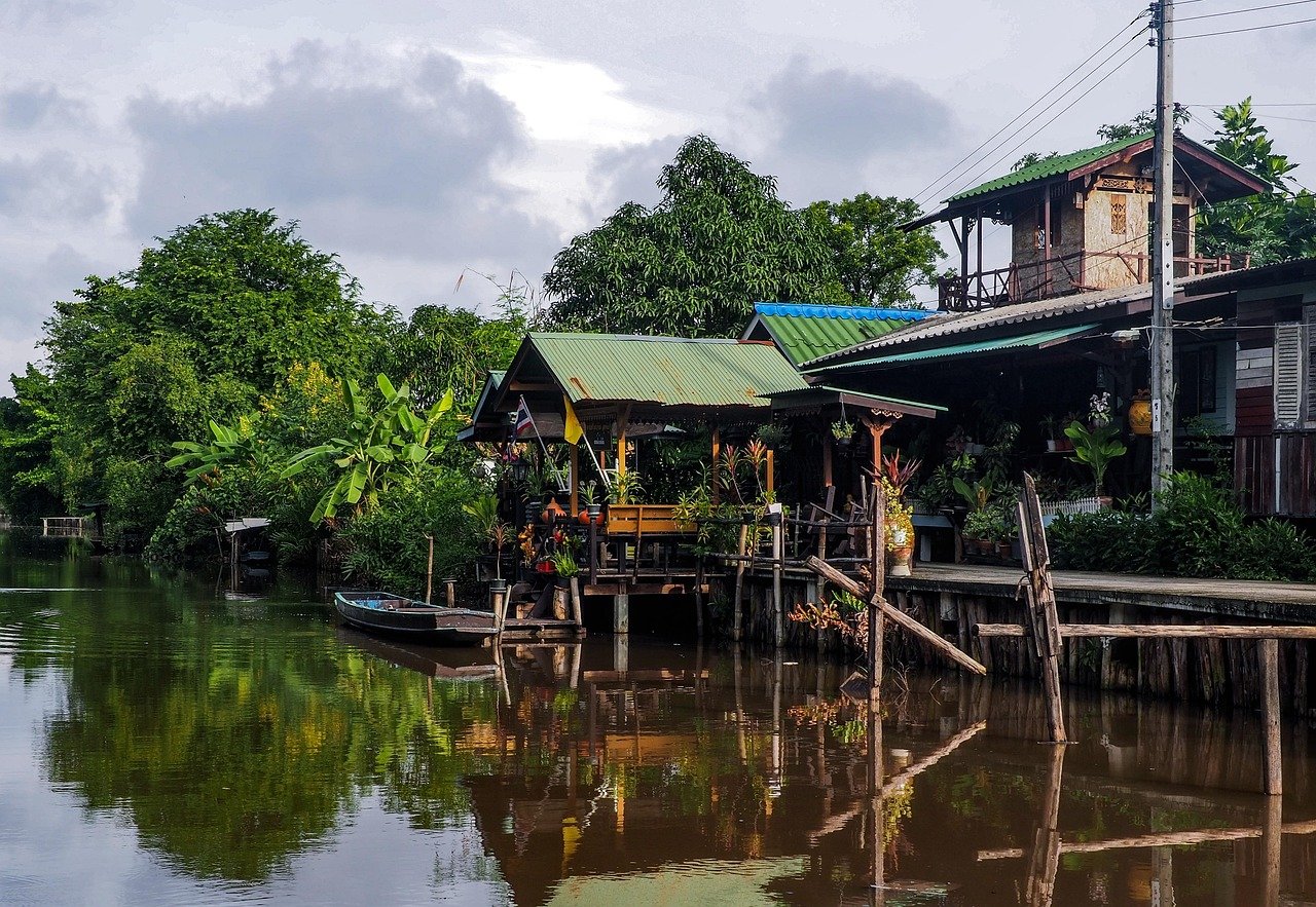 Traditional Thai wooden waterfront house on Bangkok canal