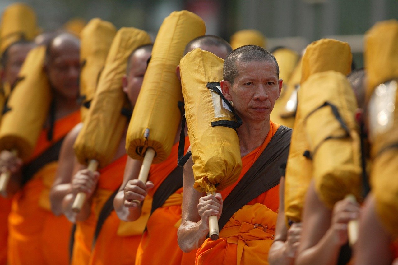 Thailand temple monks prayer devotion golden statue