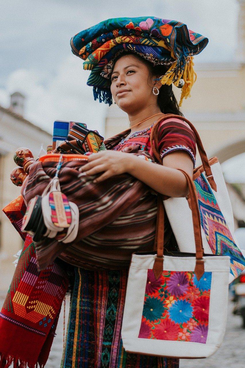 Artisan vendor colorful textiles crafts South American market fair