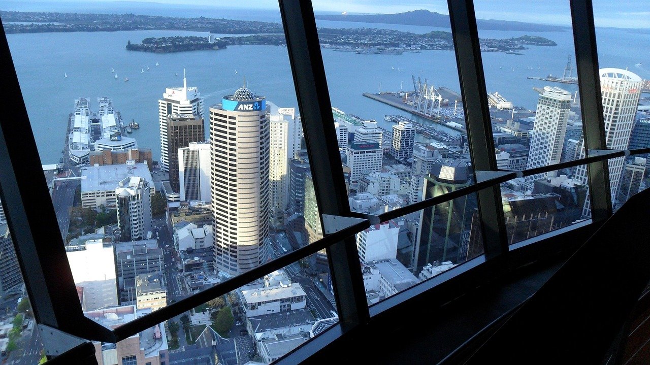 Auckland city skyline with harbour and volcanic cones seen from above