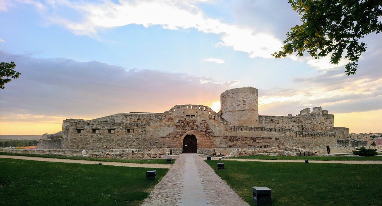 Medieval castle stone architecture Spain, evoking Torre Bellesguard Gothic heritage
