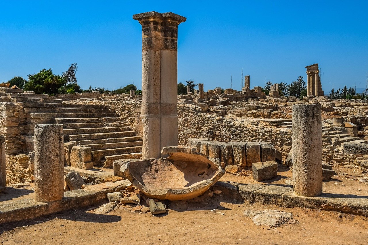 Ancient ruins and columns against a blue Mediterranean sky