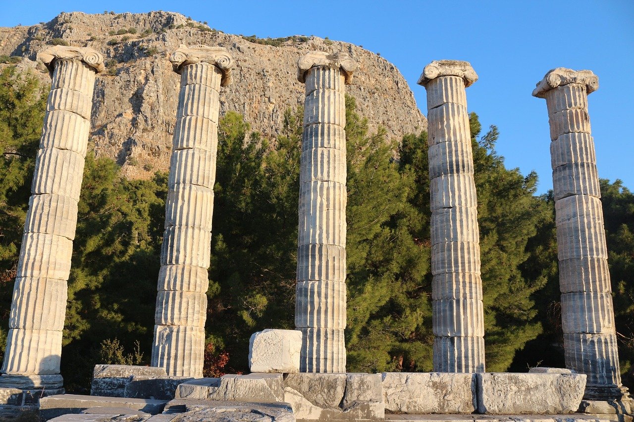 Ancient Greek theater carved into hillside with stone seats