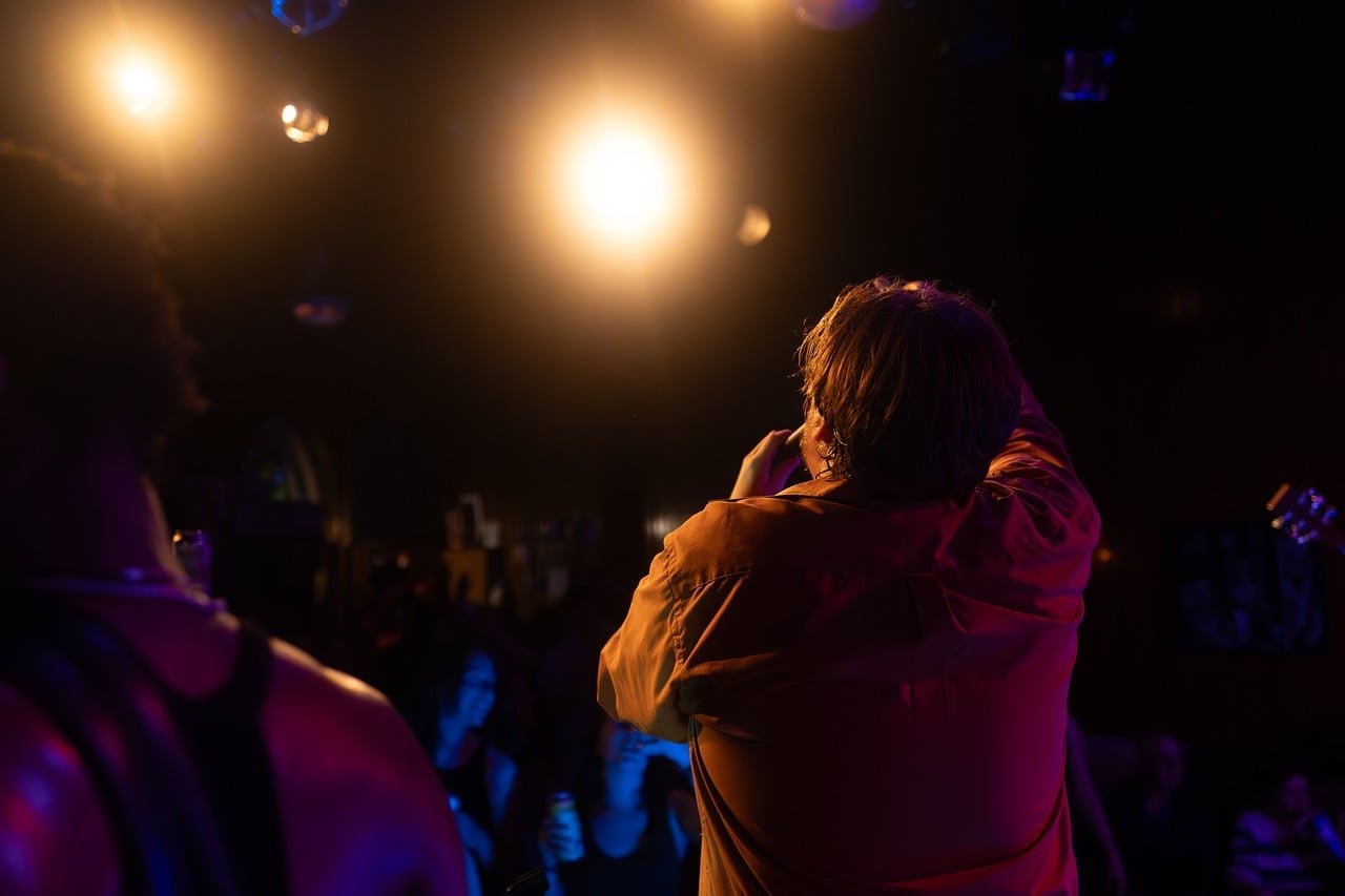 Live concert show stage spotlight performers entertainment