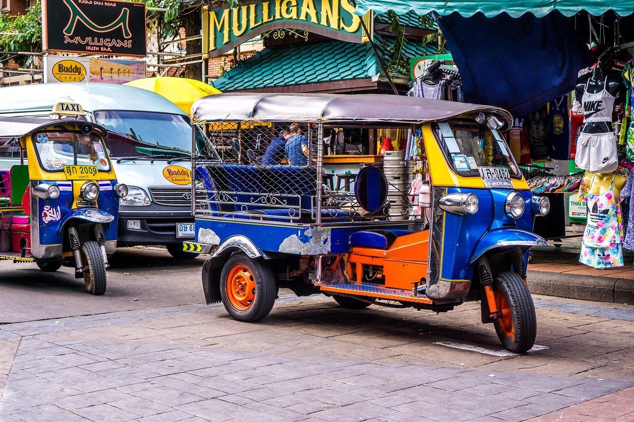 Tuk tuk taxi on Khao San Road Bangkok with tourists