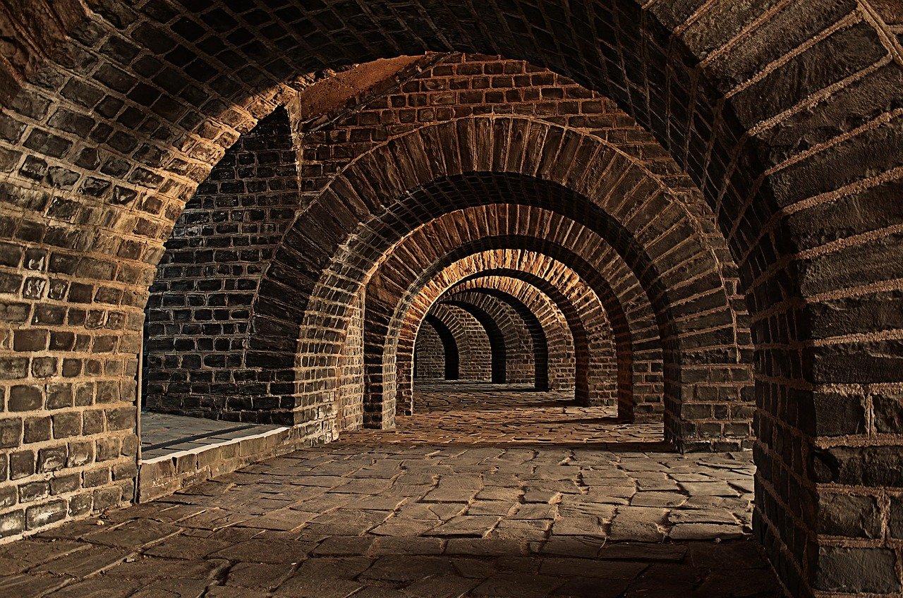 Ancient stone vaulted tunnel underground passageway