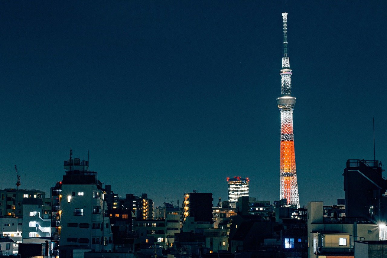 Tokyo Tower illuminated against the Tokyo night skyline