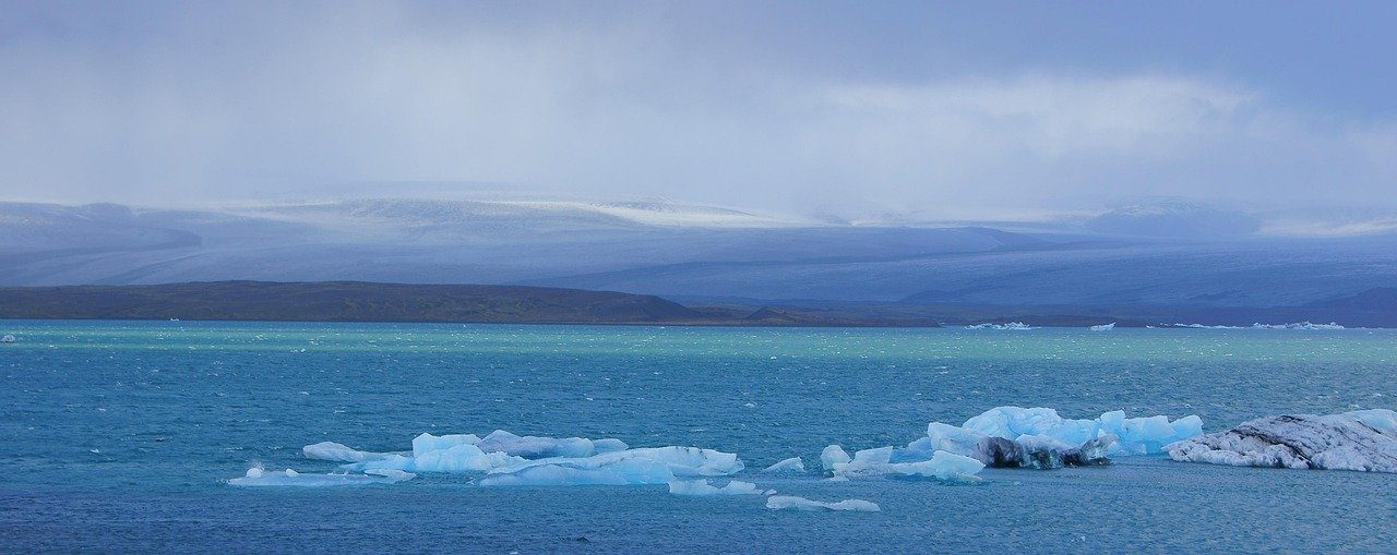Andes glacial lagoon with iceberg and clear blue sky in Argentina